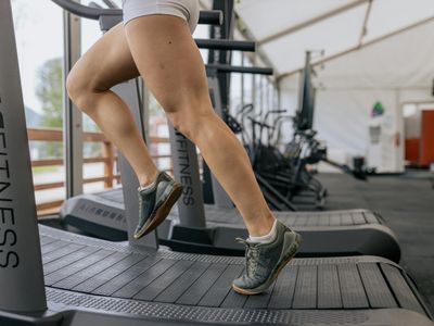 Blurred motion of legs during a cardio exercise session.